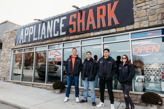The Appliance Shark team outside the storefront